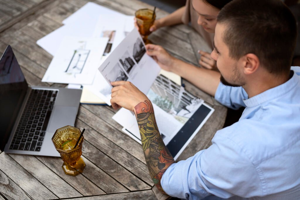 Two people reviewing documents together.